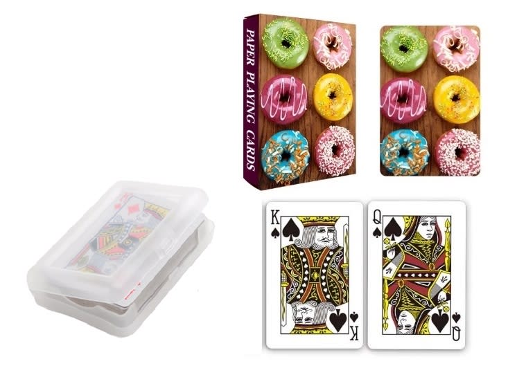 A set of paper playing cards in a clear plastic case, featuring colourful designs and standard face cards. A set of paper playing cards in a clear plastic case, featuring colourful designs and standard face cards.