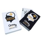 Playing cards in a standard bridge size, featuring a black and white design with a logo.