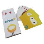 Standard poker size playing cards featuring colourful designs, with a branded box and several face-up cards displayed.