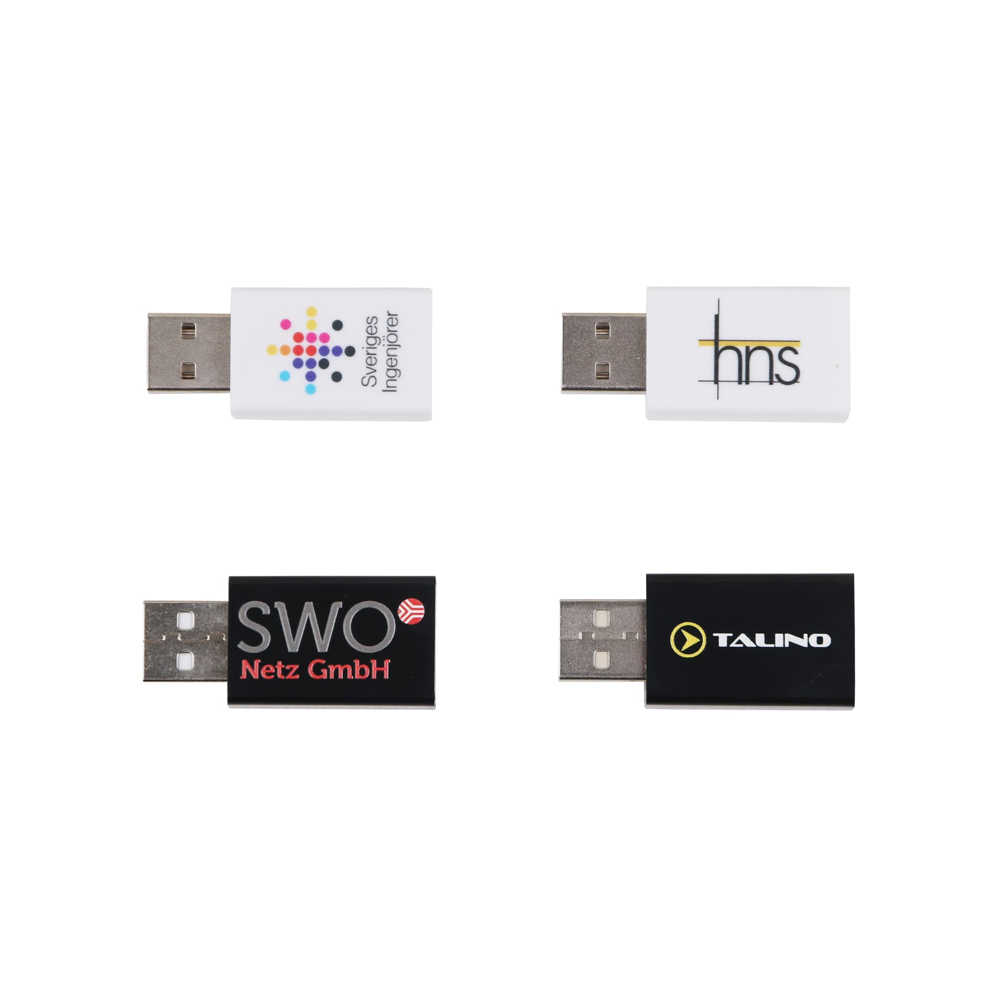 Four USB data blockers in various colours, including white, black, and grey, featuring different logos on each. USB Data Blocker - Image 1