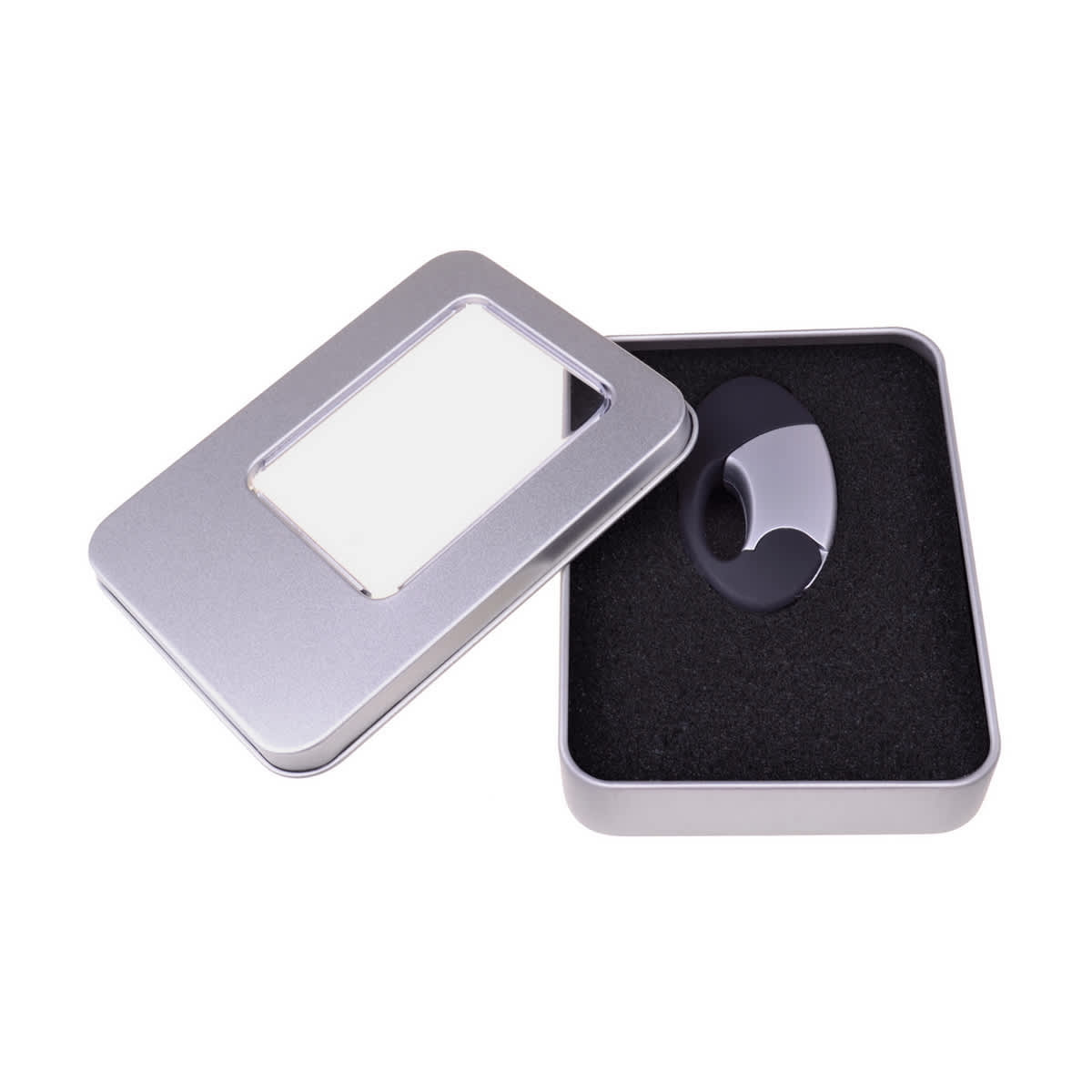 A large silver tin case with a transparent window, containing a black item on cushioned black foam. Large Tin Case - Image 1