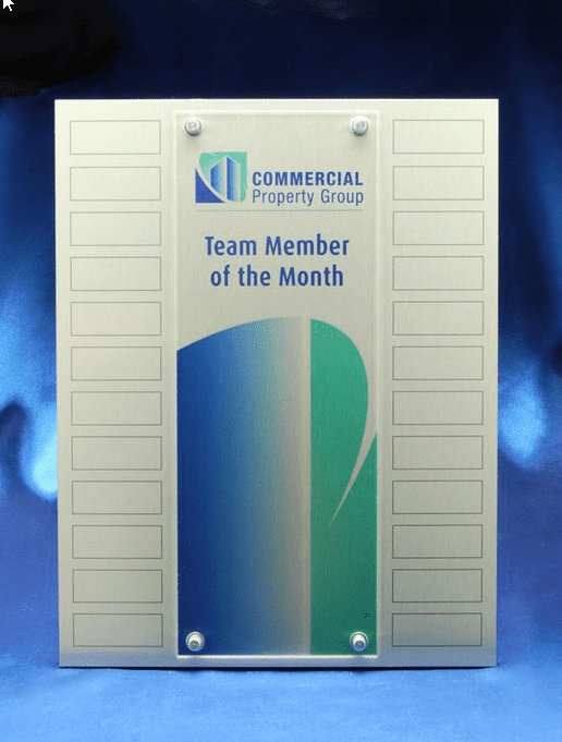 A perpetual award with a metallic finish and acrylic overlay, featuring a logo and multiple printed plates for names. Perpetual Award - With Printed Plates and Acrylic Overlay - Image 1