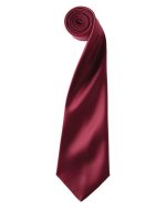 A burgundy satin tie rolled up, featuring a smooth finish and a hidden logo.