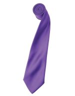 A purple satin tie rolled neatly, featuring a smooth texture and a classic shape, with a logo visible.