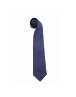A dark navy tie in a rolled position, featuring a smooth finish and a tapered end. The tie includes a logo.