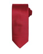 A red tie featuring a houndstooth pattern, neatly rolled at the top. It has a logo on it.
