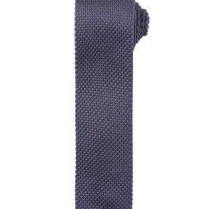 A slim knitted tie in a dark navy colour with a textured pattern, featuring a branding logo.