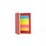A red sticky note book with assorted sticky notes in yellow, green, blue, and pink inside.