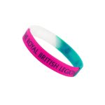 A silicone wristband in pink, teal, and white, featuring a logo or branding on its surface.