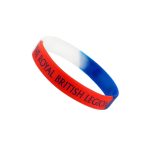 A silicone wristband featuring red, white, and blue colours, with branding on its surface.