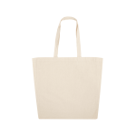 A beige calico tote bag with two handles and no visible branding.