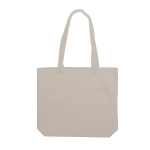 A beige canvas tote bag with two shoulder straps and a simple design. It has a logo on one side.