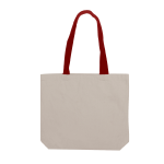 A beige tote bag with red handles. The bag features an unembellished design and a logo.
