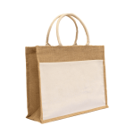 A jute beach bag in natural brown with cotton handles and a front pocket, featuring a simple design.