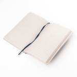 A soft smooth PU-covered notebook in light colour, featuring lined pages and a ribbon bookmark.