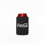 A stubby cooler in black holding a can of Coca-Cola, featuring a logo on the front.