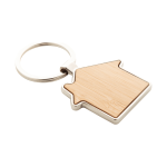 A house-shaped keyring made of bamboo with a silver metal ring, featuring a smooth, natural wood finish.