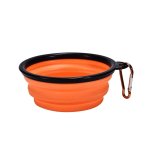 An orange silicone collapsible pet bowl with a black rim and a metal carabiner.
