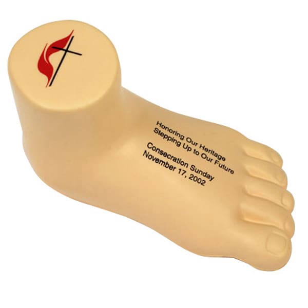 A leg-shaped stress reliever in beige with a logo on top, designed for stress relief and fun. Leg Shape Stress Reliever - Image 1
