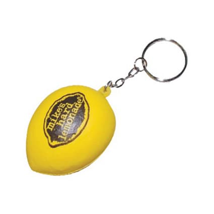 A yellow lemon-shaped stress reliever attached to a keyring, featuring a logo on its surface. Keyring with Lemon Stress Reliever - Image 1
