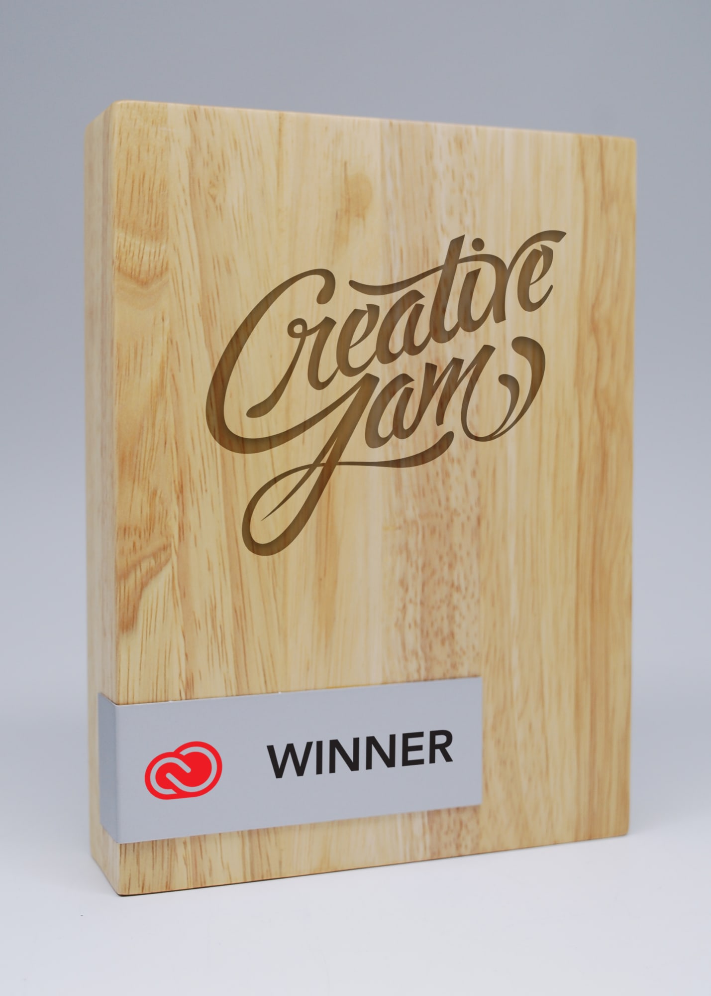 A wooden block award with a printed metal plate, featuring a natural wood grain pattern and decorative engraving. Wood Block Award with Printed Metal Plate - Image 1