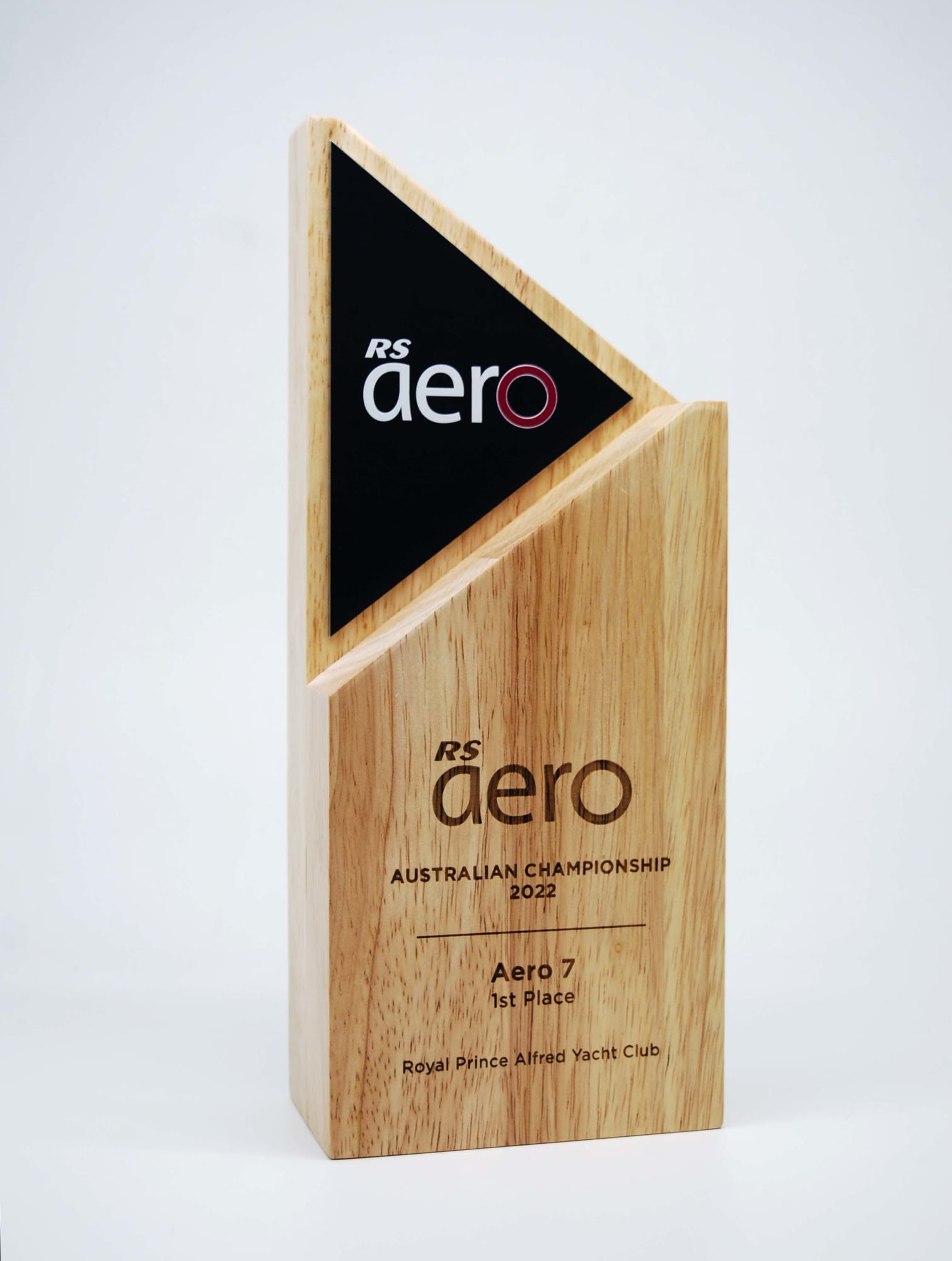 An Arrow Wood Award made of natural wood with a matte black alloy feature, showcasing a triangular design. Arrow Wood Award with Matte Black Alloy - Image 1