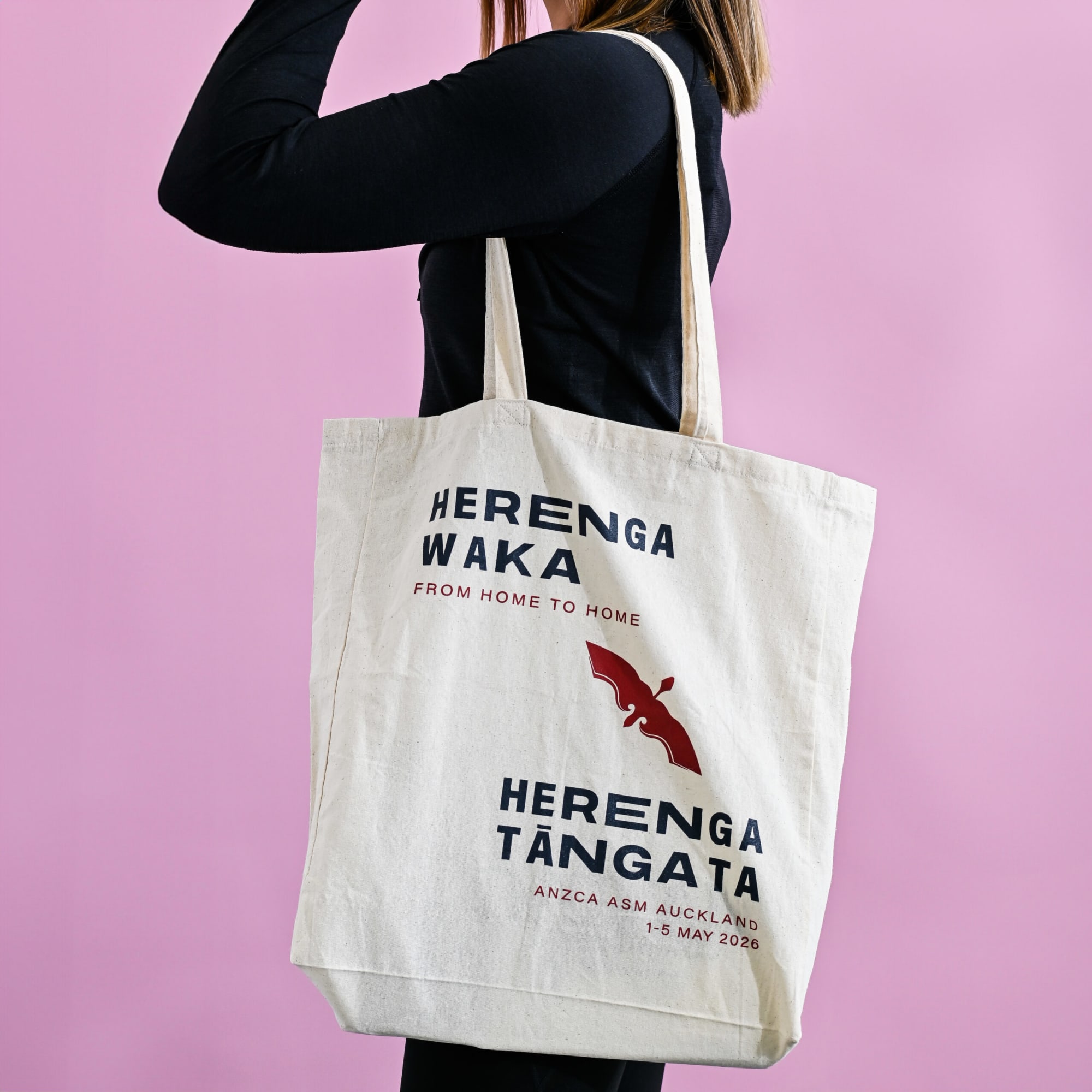 A calico tote bag with gusset, featuring a logo and text, displayed against a pink background. Calico Tote Bag with Gusset - Image 1