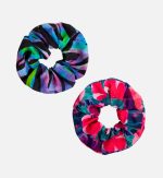 A printed scrunchie duo set featuring a vibrant black and multicoloured design and a pink and green floral pattern.