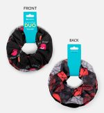 A duo set of printed scrunchies featuring black with pink lips and grey with floral designs. Includes packaging with branding.