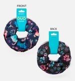 A duo set of printed scrunchies in dark fabric featuring colourful animal patterns and a branding tag.