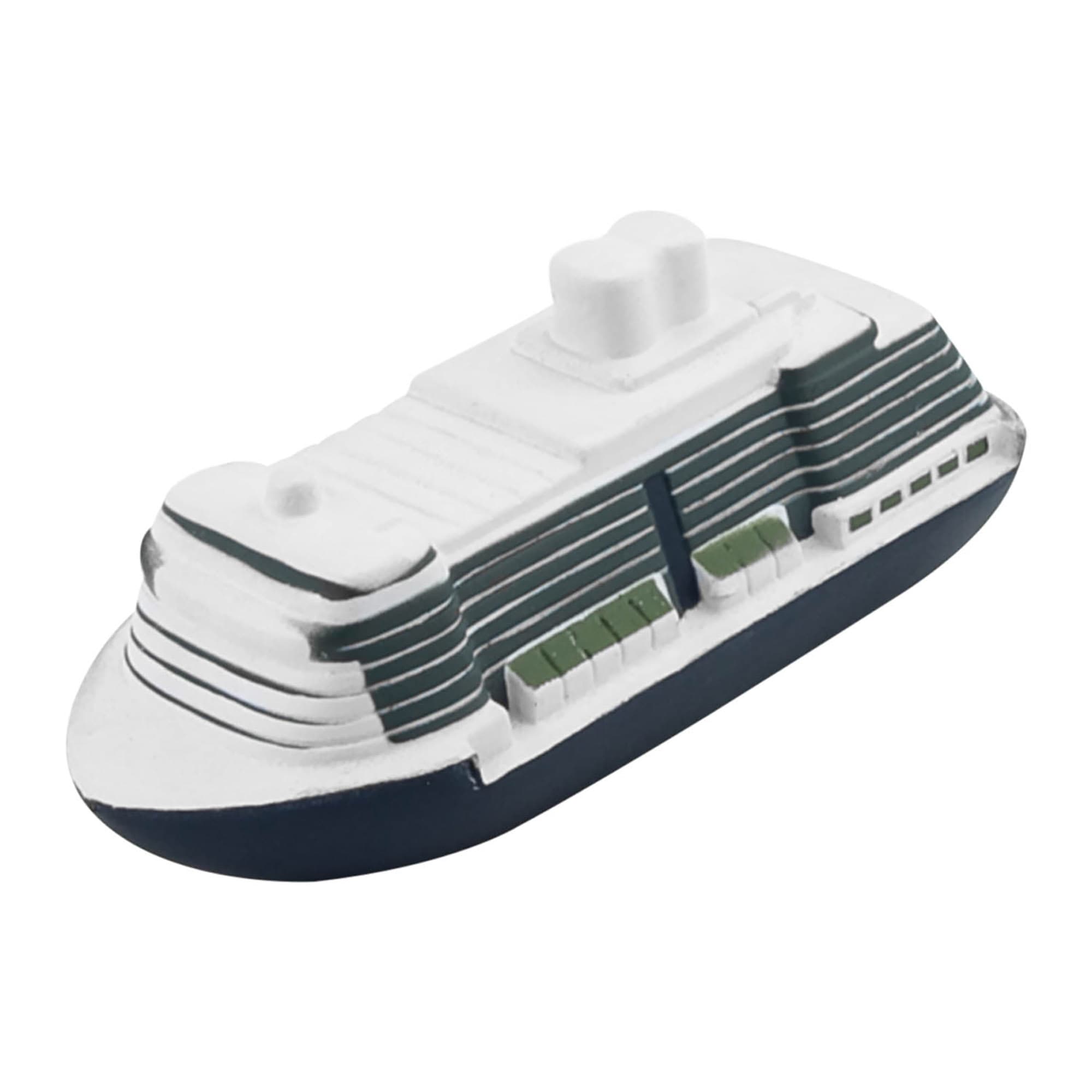 A stress relief toy shaped like a cruise ship, featuring white and navy blue colours with detailed deck designs. Stress Cruise Ship - Image 1