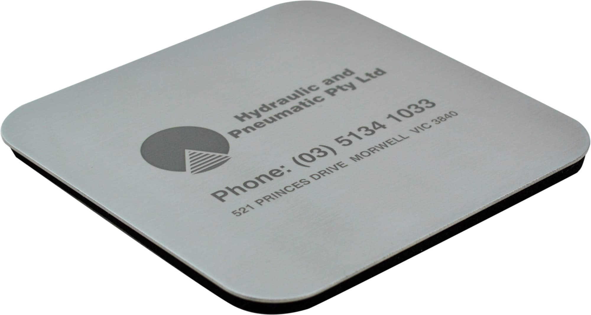A square metallic coaster featuring a logo and contact information, with a black underside. Strata Coaster - Individual - Image 1