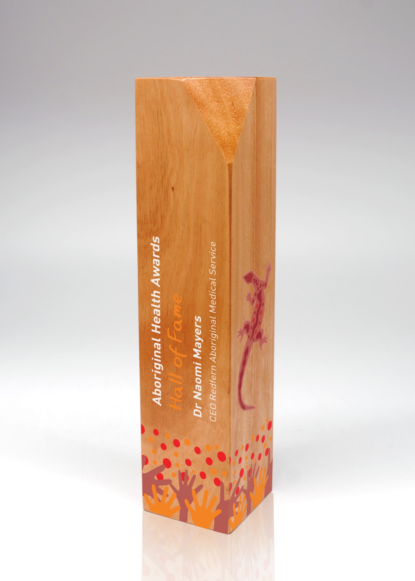 A wooden trophy with a sleek design, featuring an orange top and colourful graphics. Includes a logo. Australian Select Grade Blackbutt Beacon Trophy - Image 1
