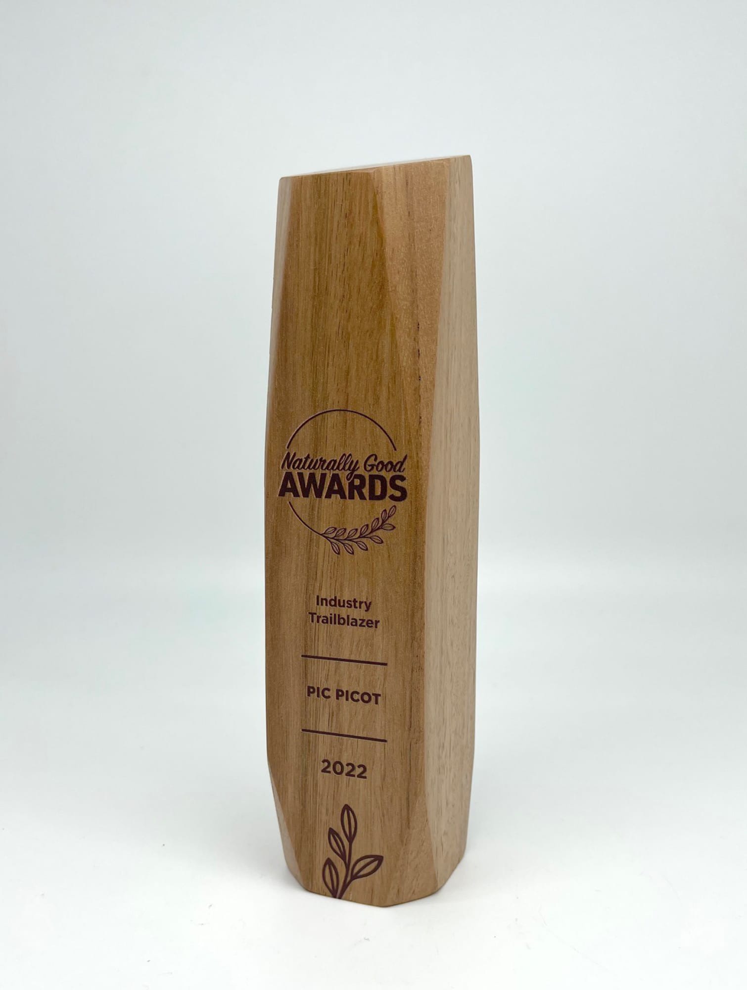 A wooden trophy with a sleek design, featuring a logo and engraved text in brown. Australian Select Grade Blackbutt Icon Trophy - Image 1
