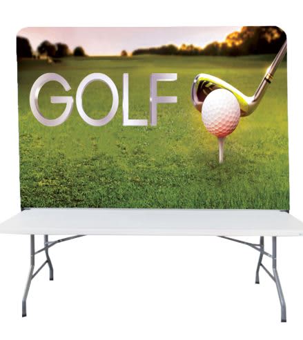 A stretch fabric table top banner stand featuring a golf theme with a large golf tee, ball, and club against a green background. Stretch Fabric Table Top Banner Stand (6ft) - Image 1
