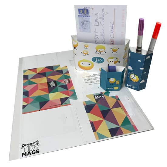 Magnetic holders in various colours, including blue and geometric patterns, with compartments for notes and pens. Magnetic holders in various colours, including blue and geometric patterns, with compartments for notes and pens.