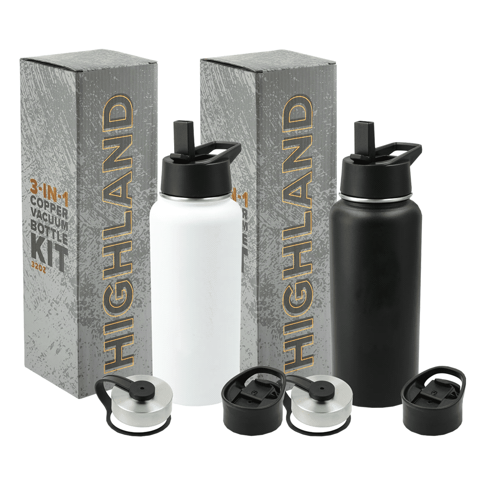 A drink bottle kit featuring a white and a black 950ml copper vacuum bottle, with interchangeable lids and packaging. Trekk Highland 3-In-1 Copper Vacuum Bottle Kit 950ml - Image 1