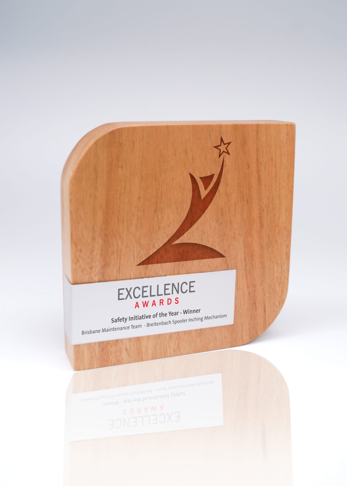 A wooden trophy featuring a stylised design and a metal wrap, showcasing an award for 'Excellence Awards'. Australian Select Grade Blackbutt Form Trophy with Metal Wrap - Image 1
