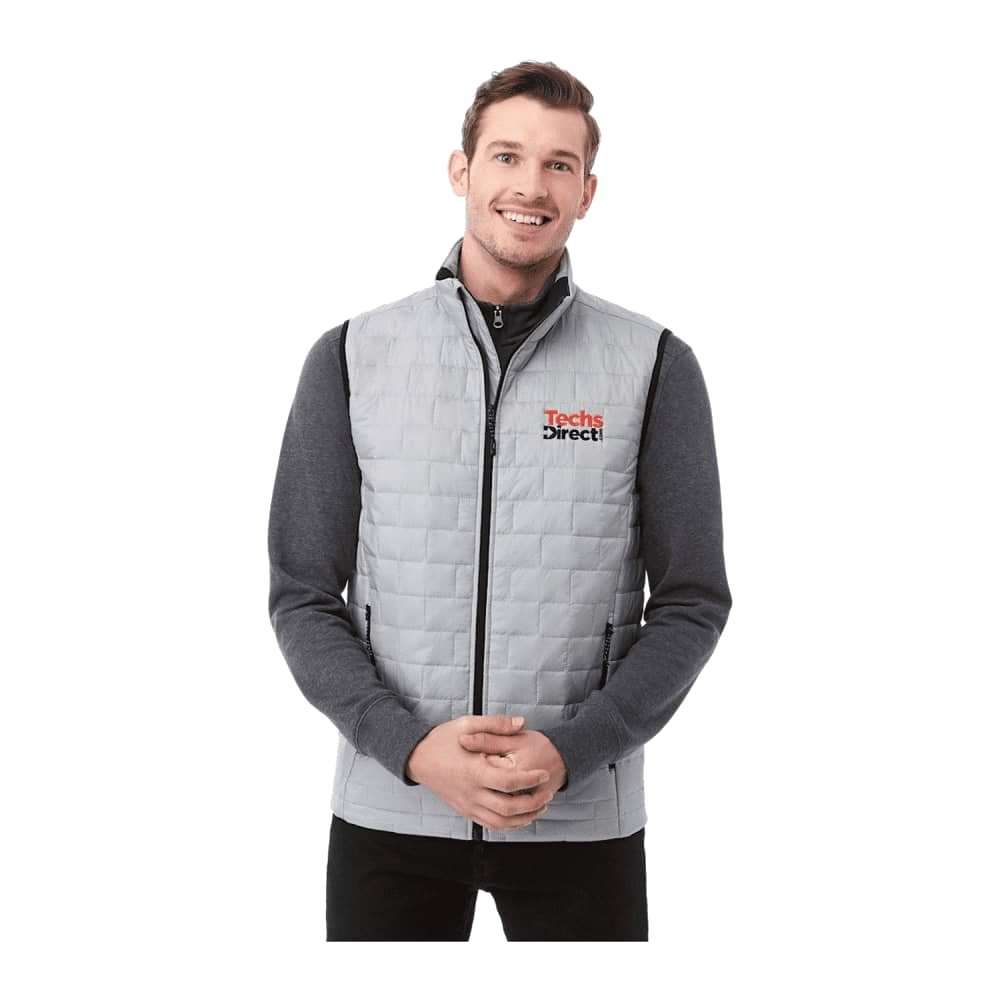 A light grey insulated puffer vest with a zip front and a logo, featuring a fitted design and a high collar. Men's Telluride Lightweight Packable Insulated Puffer Vest - Image 1