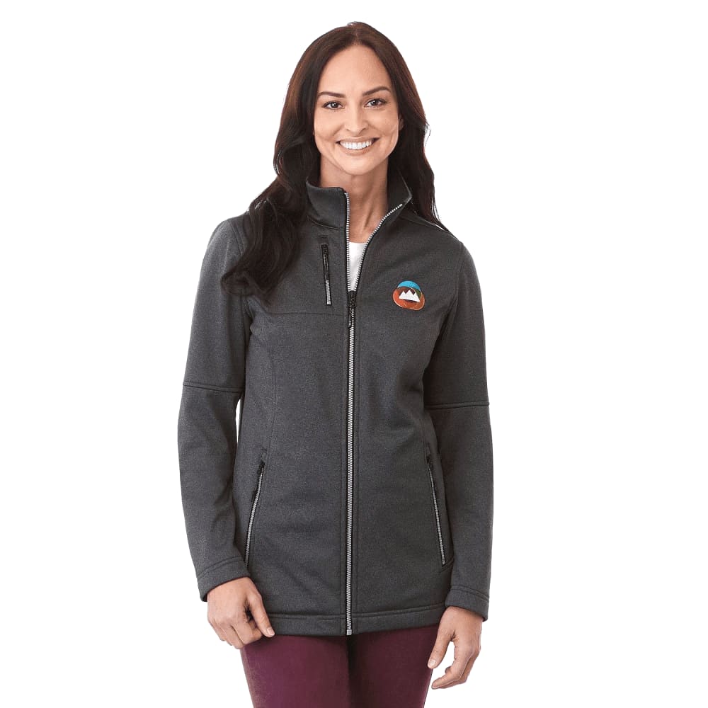 A woman wearing a charcoal grey softshell jacket with a logo on the chest and zippered pockets. Women's Joris Eco Waterproof Softshell Jacket - Image 1