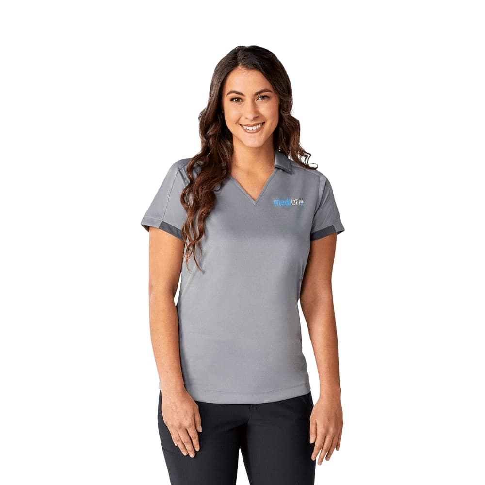 A grey short sleeve women's polo shirt with a collar and logo on the front. Women's Cerrado Short Sleeve Performance Polo - Image 1