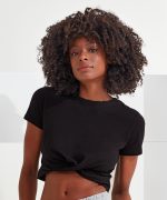 A black Twist Crop Top is worn by a model with curly hair, featuring a knotted detail at the front.