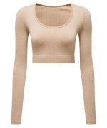 A ribbed seamless crop top in a light beige colour with long sleeves and a rounded neckline. Features a logo.