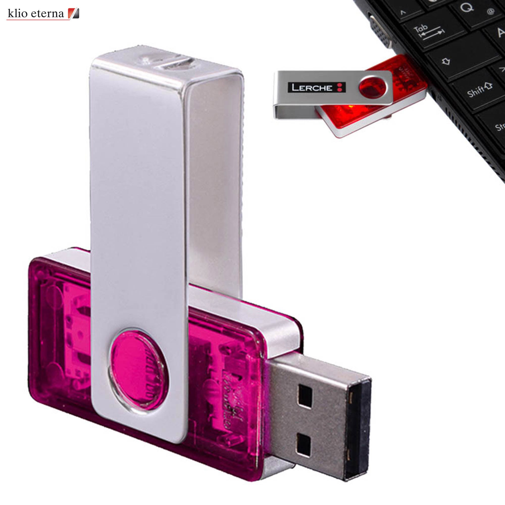 A silver and pink USB flash drive with a metal clip, featuring a logo and connected to a keyboard. USB with Metal Clip 32GB - Image 1