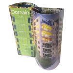 A curved desk calendar featuring a residential building image in green and blue tones, with a branded logo.