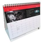 A5 wiro bound desk calendar featuring a red and grey design with a spiral binding. Includes space for monthly dates and notes.