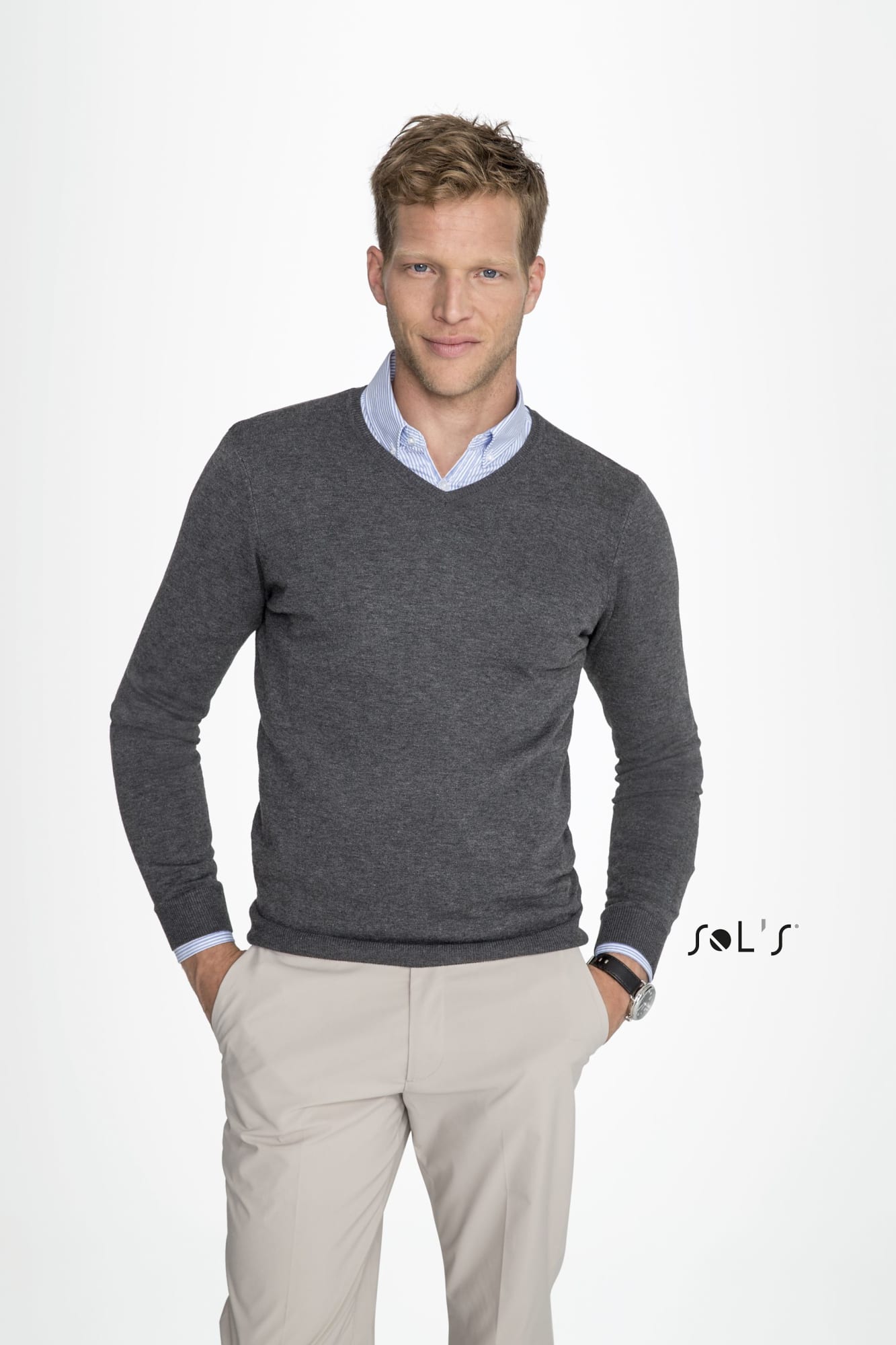 A grey V-neck men's jumper worn over a light blue shirt, modelled by a man with short blonde hair. Features a logo. Jumper V neck men's GLORY - Image 1