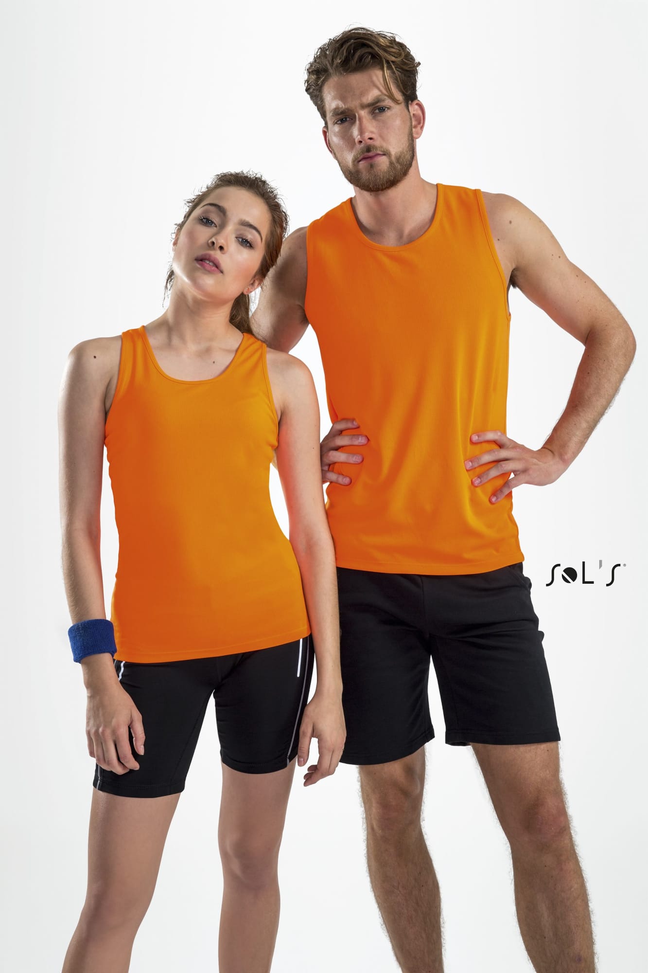 Two models wearing bright orange tank tops made of 100% breathable polyester, paired with black shorts. Singlet / Tank top men's 100% breathable polyester SPORTY - Image 1