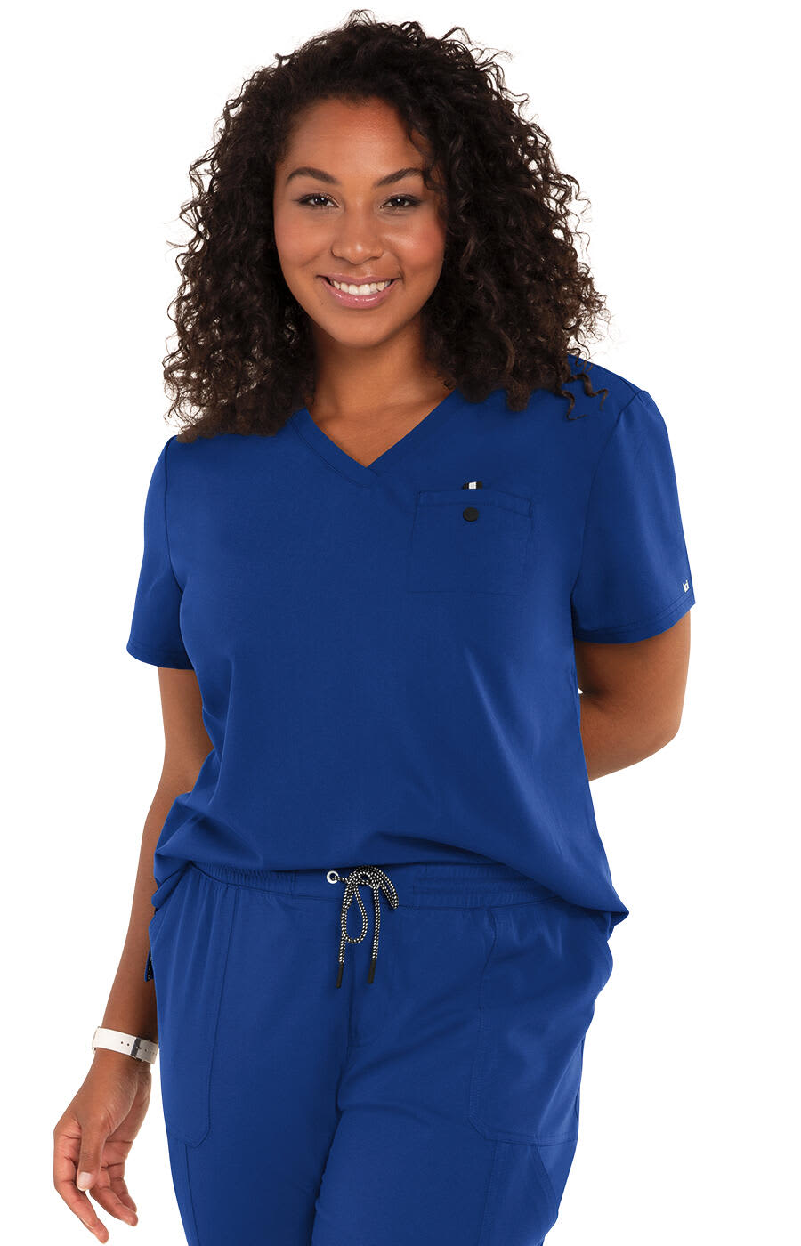 A woman wearing a blue "Ready to Work Top" with a V-neck and a chest pocket, smiling at the camera. Ready to Work Top - Image 1