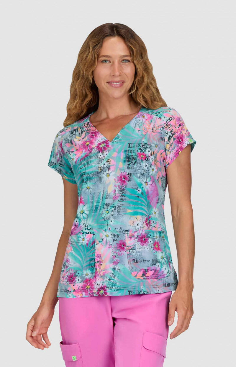 A floral print top in shades of green, pink, and blue, featuring a V-neck and short sleeves. Meadow Top (Print) - Image 1